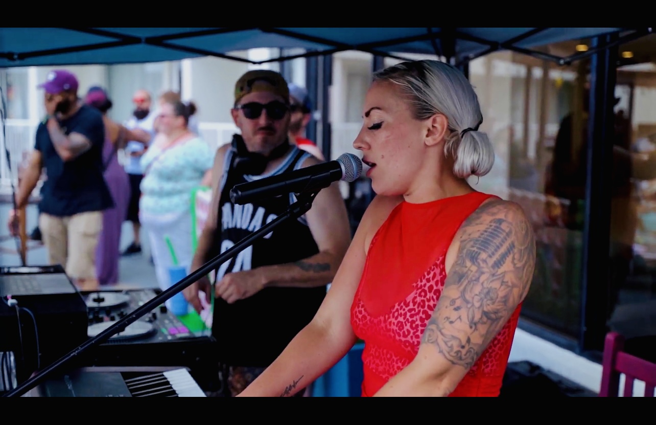 Clarissa performing keys at outdoor event