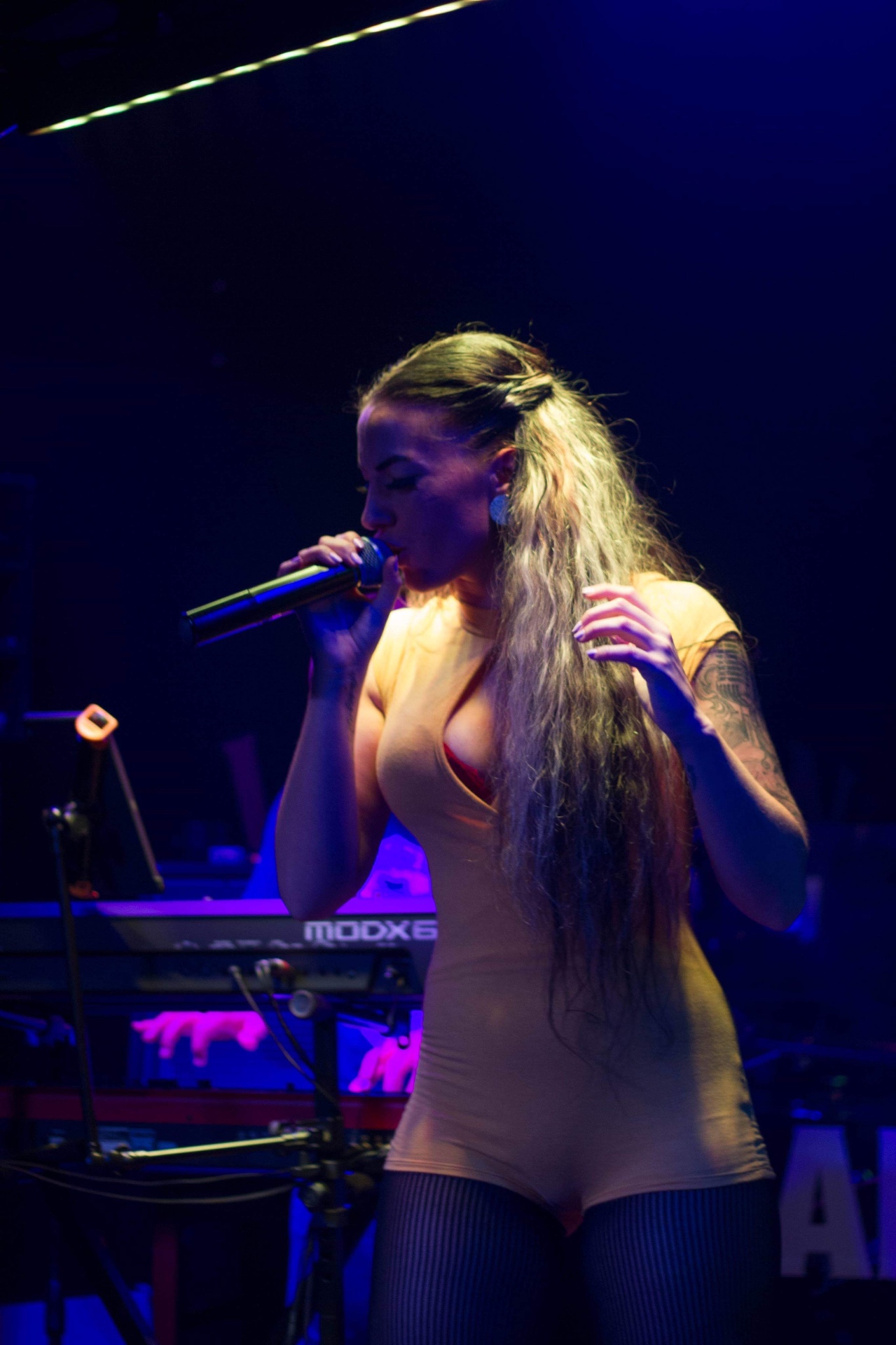 Clarissa performing with mic
